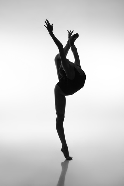 Silhouette of a dancing ballerina - Foto, afbeelding