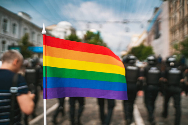 Hand hold a gay lgbt flag at LGBT gay pride parade festival - Photo, Image