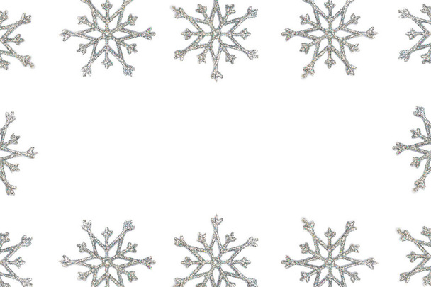 Natal floco de neve borda quadro fundo. Prata floco de neve vista superior isolado no fundo branco
 - Foto, Imagem