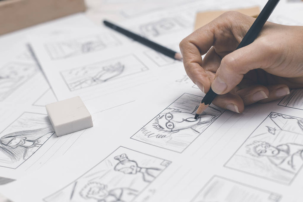 An animator artist draws storyboards. - Photo, Image