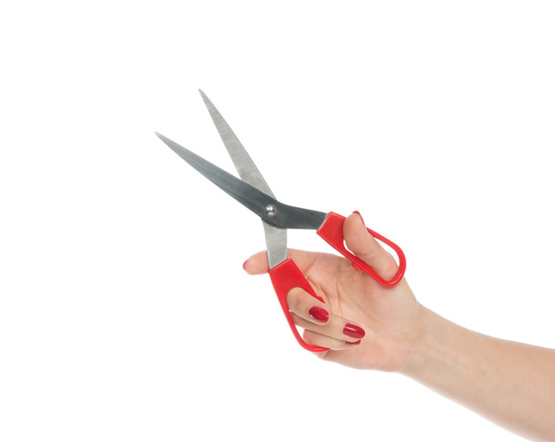 Woman hand holding red scissors - Photo, Image