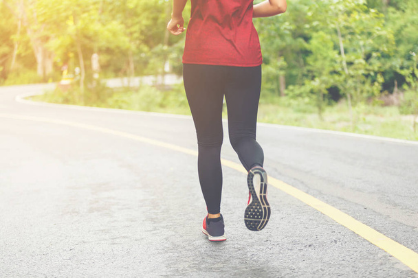 Legs of woman runner. - Фото, изображение