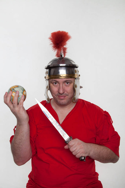 A roman soldier with a globe and dagger - Photo, Image