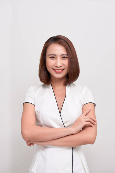 Smiling asian business woman on white background - Фото, изображение