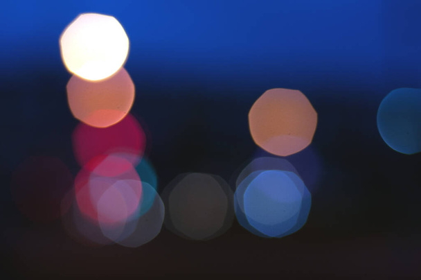Bokeh lights on road in the city, night lights in city, street lights bokeh background, blur of night lights bokeh on street, Cinematic lens shot - Φωτογραφία, εικόνα