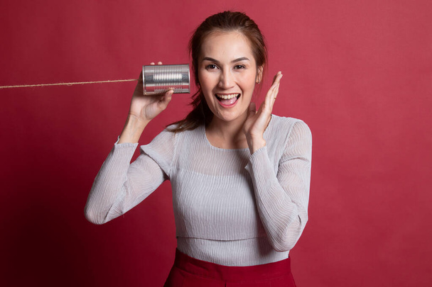 Happy Young Asian woman listen with tin can phone. - Valokuva, kuva