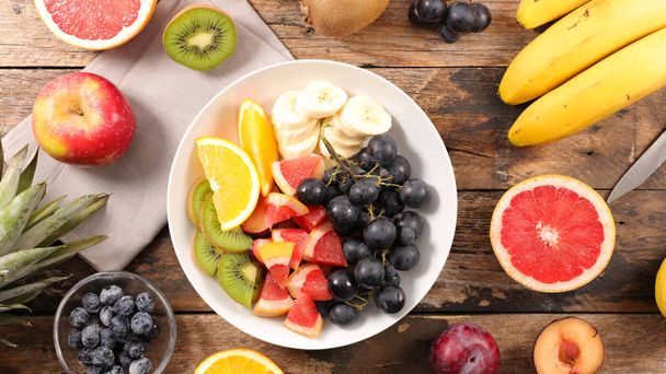 fresh fruit salad with banan,grape,grapefruit ,orange and blueberry - Zdjęcie, obraz