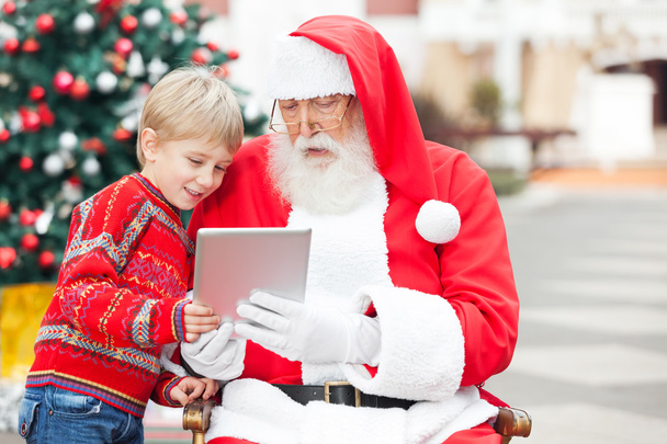 Boy And Santa Claus Using Digital Tablet - Fotoğraf, Görsel
