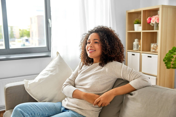 happy african american young woman at home - Foto, afbeelding
