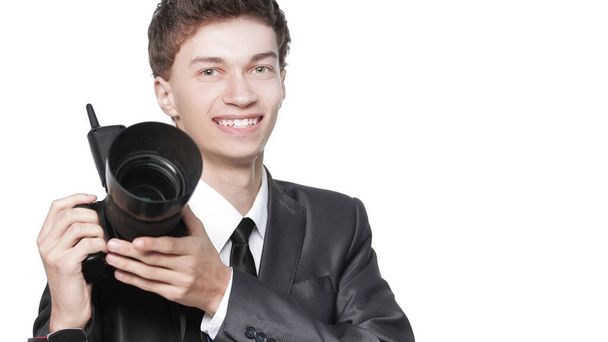 Portrait of young handsome photographer holding the camera - Foto, imagen