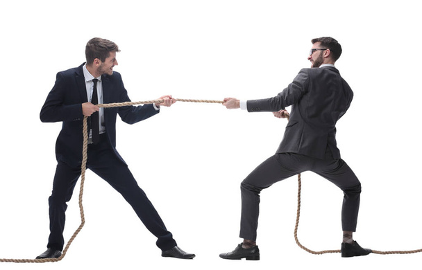 full length . two smiling businessmen pulling the rope. - Foto, immagini