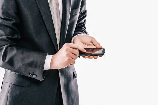close up. businessman typing SMS on smartphone - Zdjęcie, obraz