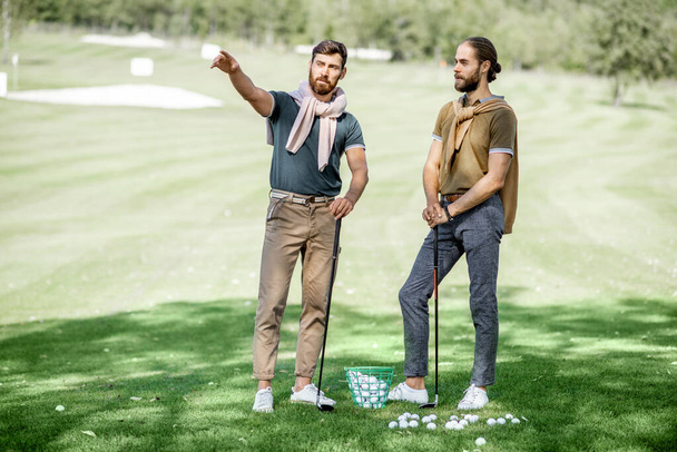 Male friends on a golf course - Fotografie, Obrázek