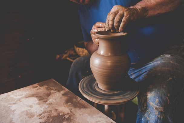 Professional potter making vase in pottery workshop - Photo, Image
