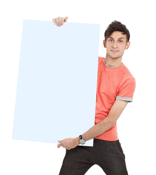 modern guy in a yellow shirt showing blank poster - Foto, afbeelding