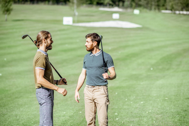 Male friends on a golf course - Photo, Image