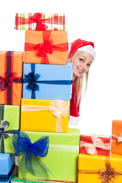 Smiling Christmas woman behind presents - Foto, imagen