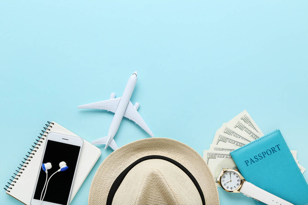 Airplane model with passport, smartphone, hat and dollar banknot - Φωτογραφία, εικόνα
