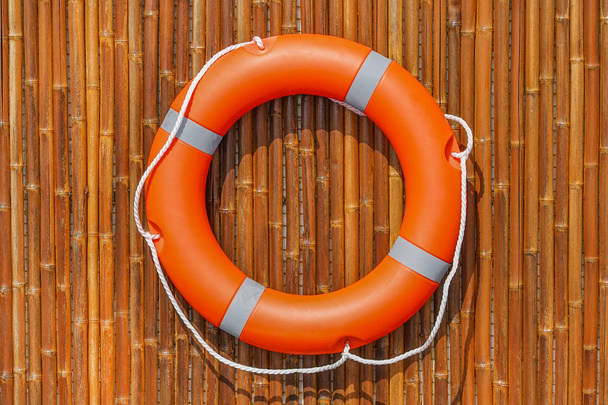 Orange lifebuoy pool ring float - Foto, imagen