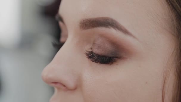 Professional makeup artist woman stirs makeup cream on a palette. - Felvétel, videó