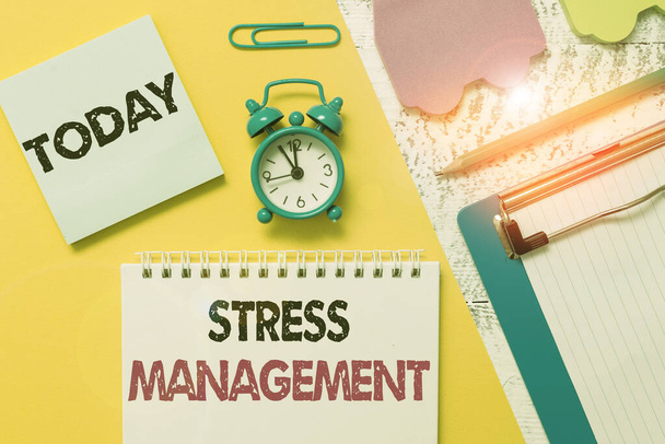 Word writing text Stress Management. Business concept for method of limiting stress and its effects by learning ways Notepad clipboard clip sheet marker car sticks alarm clock wood background. - Photo, Image