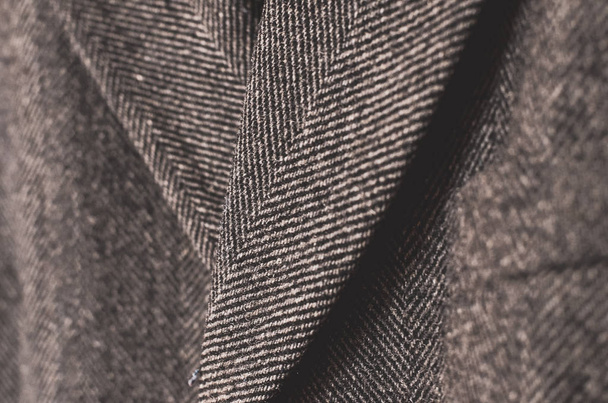 Темно-сіре тонке пальто крупним планом
 - Фото, зображення