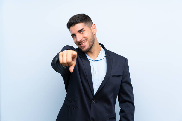 Handsome man over isolated blue background points finger at you with a confident expression - Photo, Image