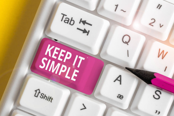Writing note showing Keep It Simple. Business photo showcasing to make something easy to understand and not in fancy way White pc keyboard with note paper above the white background. - Photo, Image