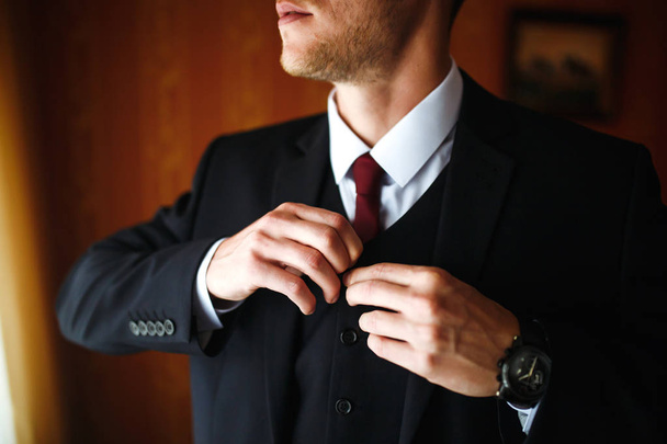 Luxury groom in suit. Businessman. Morning Groom Fees. The beginning of the wedding day. Stylish sexy man in suit posing. Men's fashion. - Φωτογραφία, εικόνα