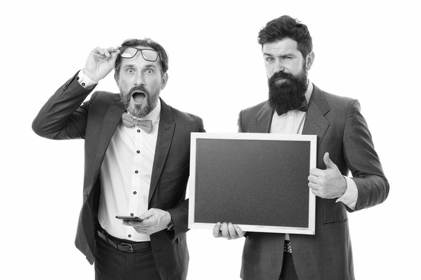 announcement. party invitation. businessmen use phone, copy space. bearded men hold advertisement blackboard. partners celebrate start up business isolated on white. welcome on board announcement - Φωτογραφία, εικόνα