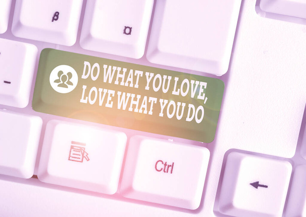 Handwriting text Do What You Love Love What You Do. Concept meaning you able doing stuff you enjoy it to work in better places then White pc keyboard with empty note paper above white background key c - Photo, Image
