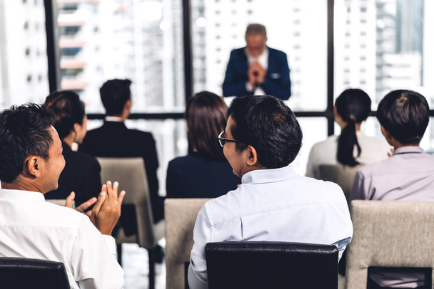 Businessman standing in front of group of people in consulting m - Photo, Image