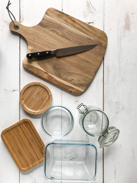Wooden cutting board and glass jars - Fotografie, Obrázek