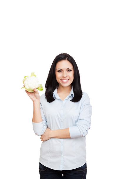Жінка тримає зелену сиру свіжу капусту
 - Фото, зображення