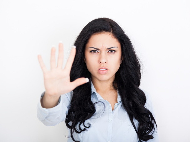 Woman making stop hand sign palm gesture - 写真・画像
