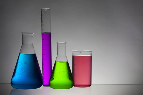 Liquid in laboratory bottles. Scientific biochemical laboratory. Colorful liquid. - Foto, afbeelding