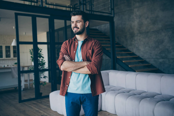 Profile side photo of positive cheerful bearded guy real optimistic entrepreneur dream he will have successful company start up cross hands wear casual style clothing in house indoors loft - Foto, Imagem