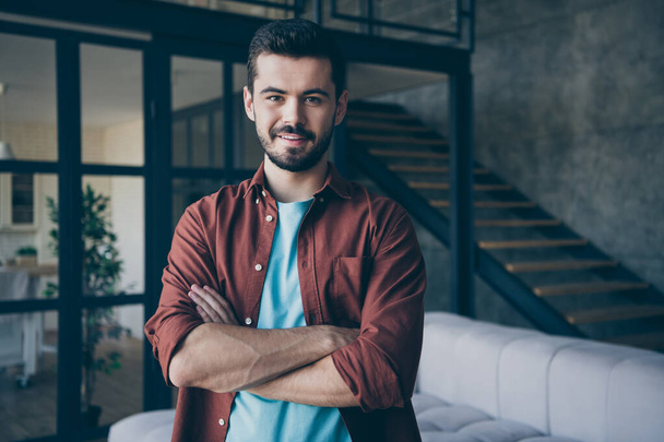 Close up photo of confident smart bearded freelancer guy cross his hands feel success in work career ready to solve job problems wear casual style outfit in house indoors loft - Fotó, kép