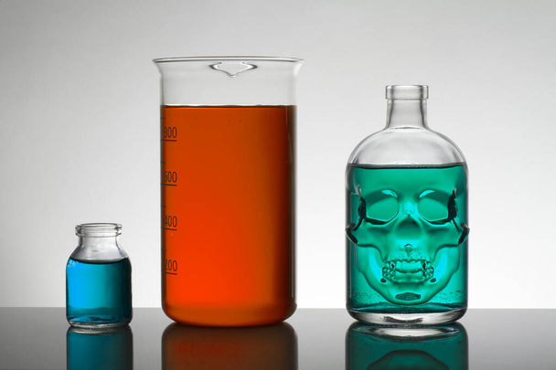 Liquid in laboratory bottles. Scientific biochemical laboratory. Colorful liquid. - Photo, Image