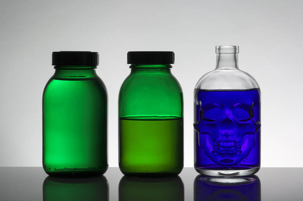 Liquid in laboratory bottles. Scientific biochemical laboratory. Colorful liquid. - 写真・画像
