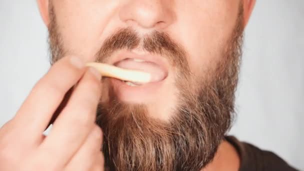 portrait male eats french fries - Footage, Video