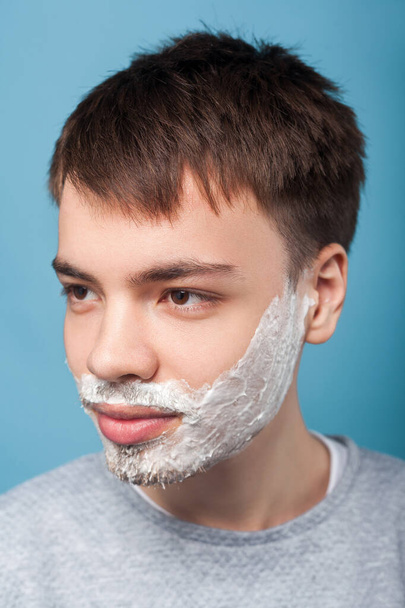 Portrait of young man with shaving foam ready to shave beard. in - Photo, Image