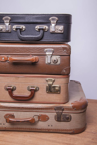 Old, retro, suitcases lie on the table with white background - Photo, image
