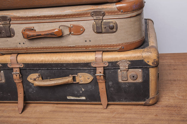 Old, retro, suitcases lie on the table with white background - Фото, зображення