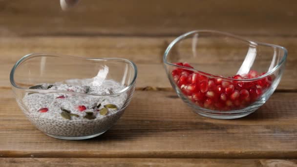 Eating healthy breakfast with chia , pumpkin seed and raw pomegranate. - Video