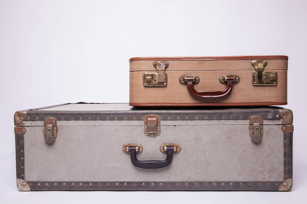 Old, retro, suitcases lie on the table with white background - Photo, Image