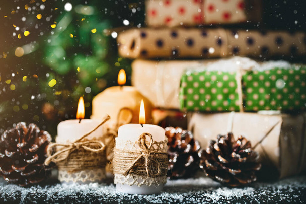 Christmas present on dark wooden background in vintage style. Merry Christmas and happy New year. Selective focus. - Photo, Image
