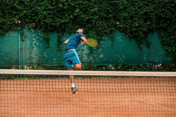 Perfect technique, skills and agility. Tennis practice at outdoor court. - Foto, imagen