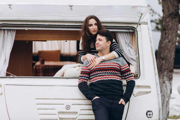 Loving couple alone in a trailer on a trip. Romance for lovers. - Photo, Image
