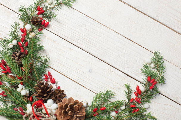 Christmas wreath on white wooden backdrop - Photo, Image